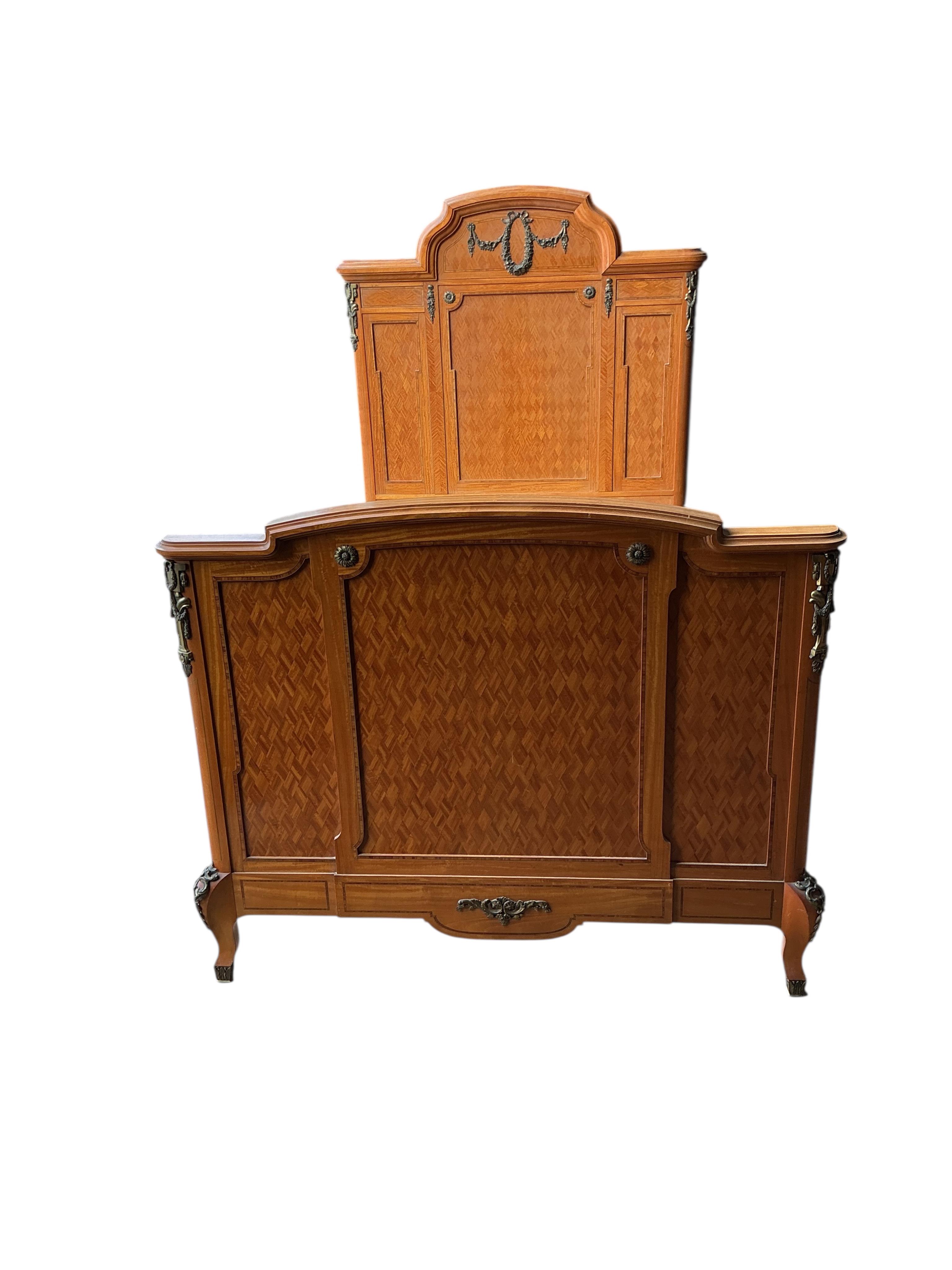 A pair of early 20th century French transitional style gilt metal mounted parquetry inlaid 4ft. bedframes, height 150cm